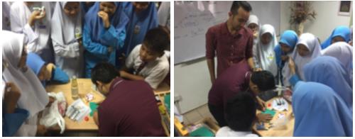 The teacher demonstrating lino print making craft using the CFK in class